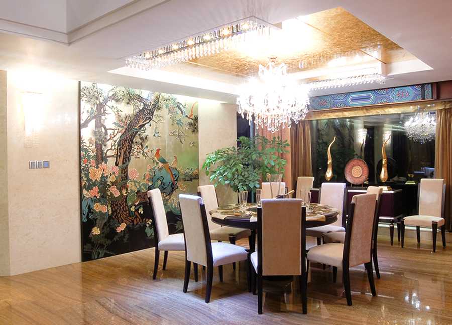 Elegant dining room with crystal chandelier featuring chinoiserie style decor.