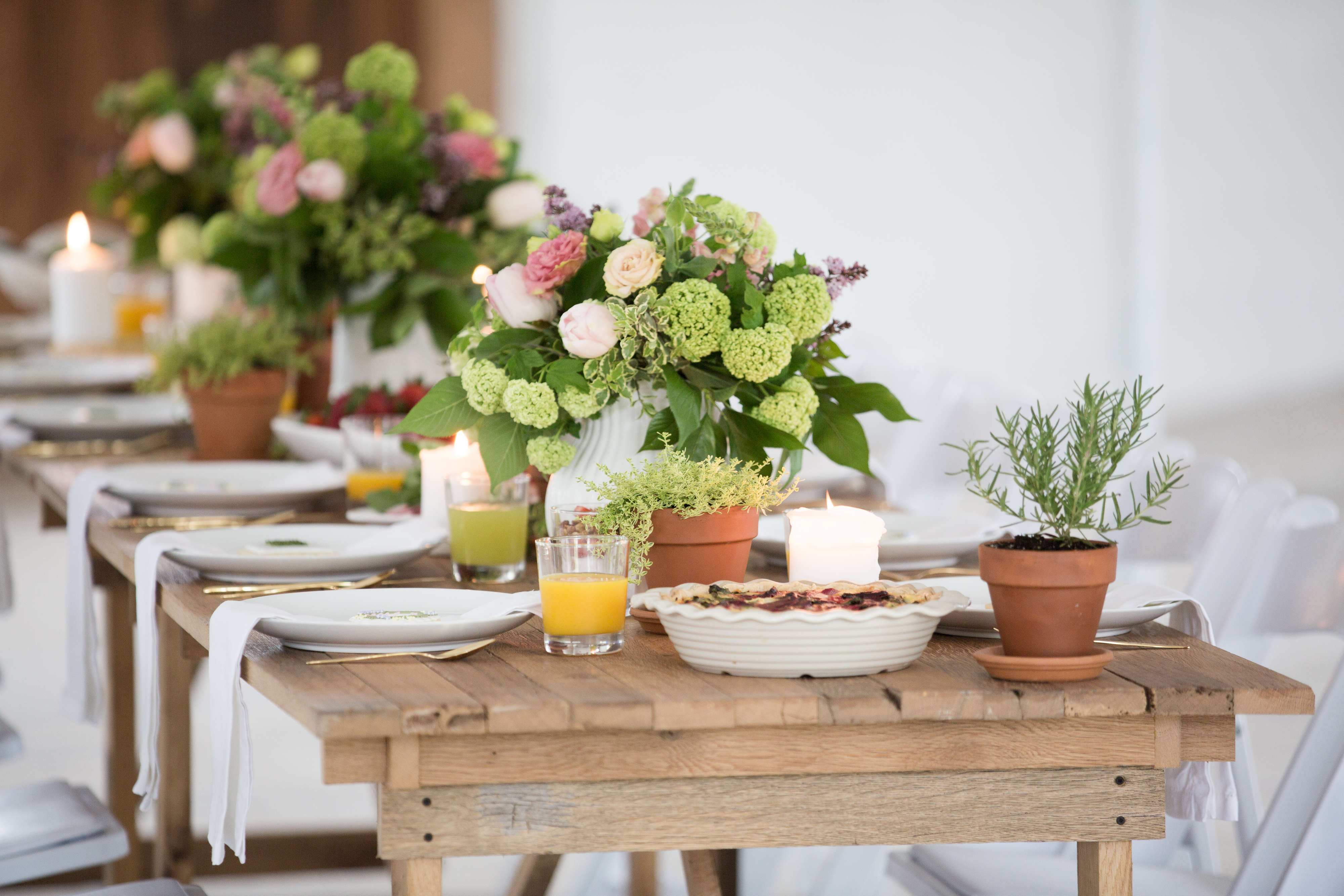 floral arrangements and place settings on picnic table