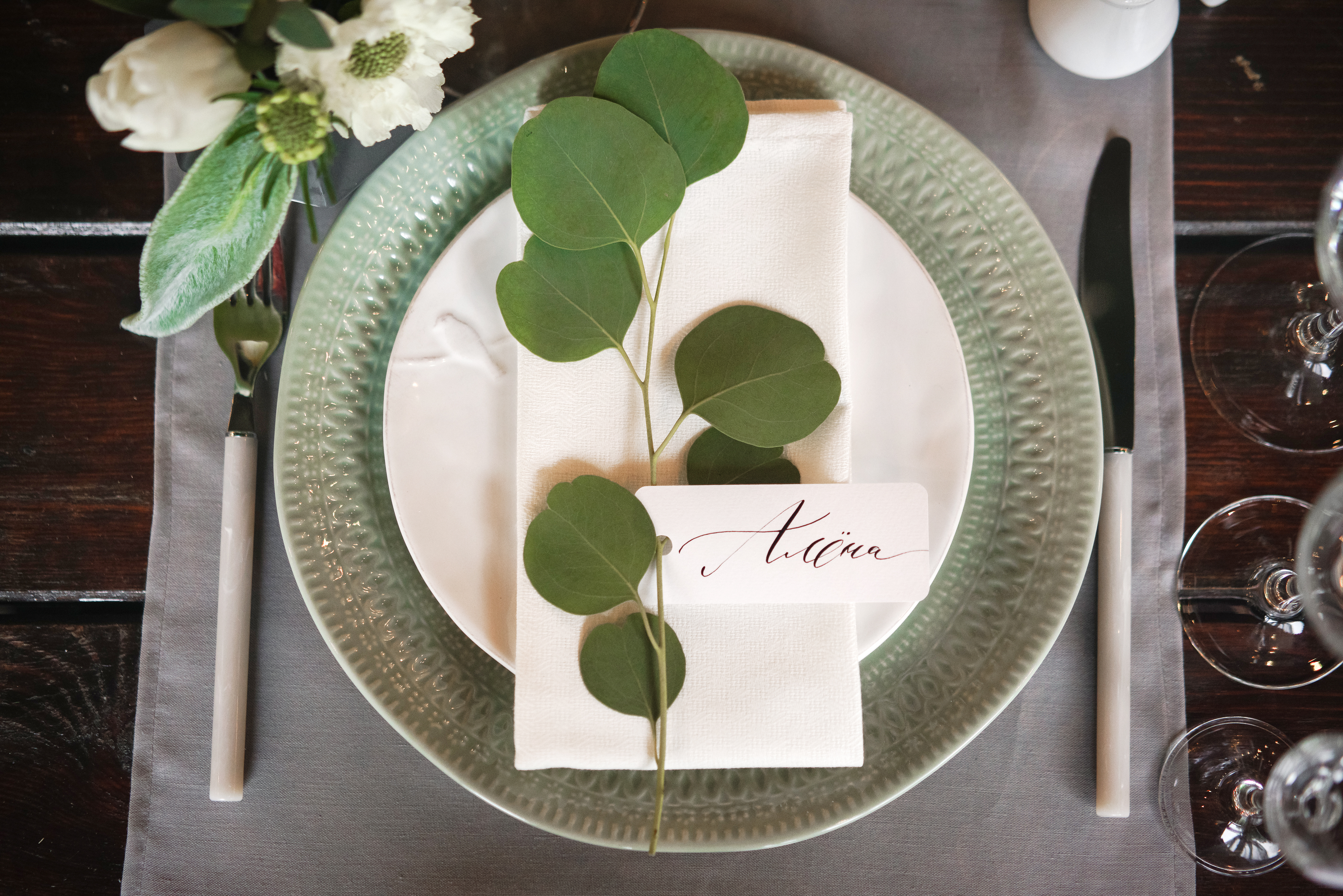 place setting with leafy accent and flowers