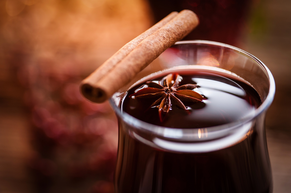 Hot Spiced Wine with cinnamon in glass mug