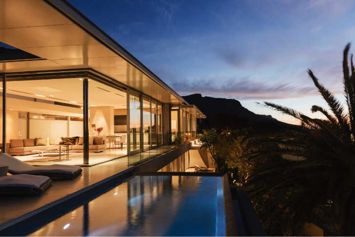 Evening photo of home with infinity pool